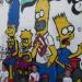 Les enfants devant le tag des Simpson